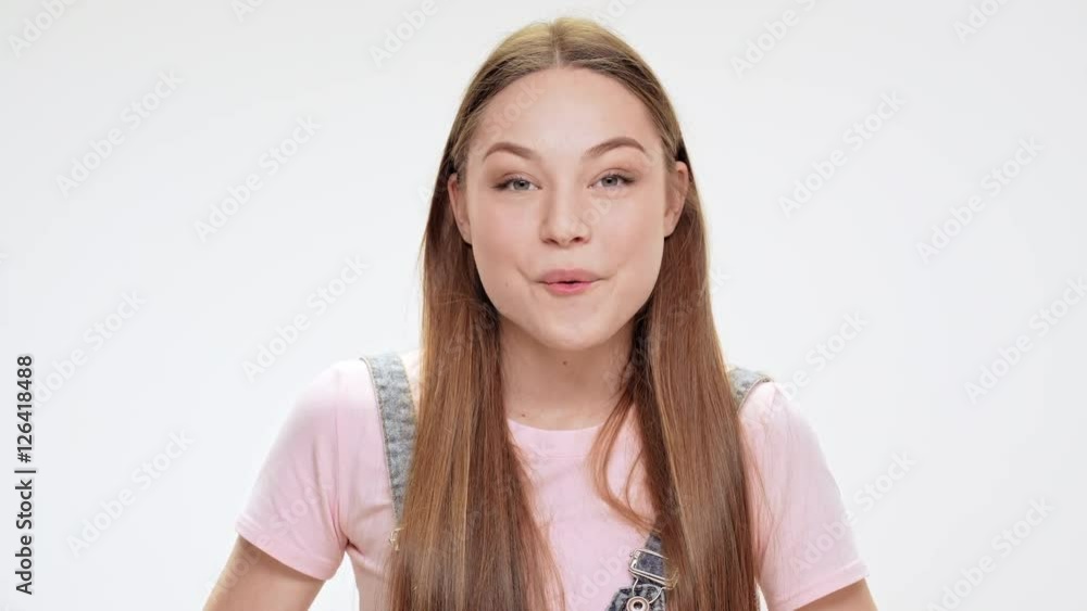 Surprised young beautiful girl smiling, laughing over white background. Surprised young beautiful girl smiling, laughing over white background.