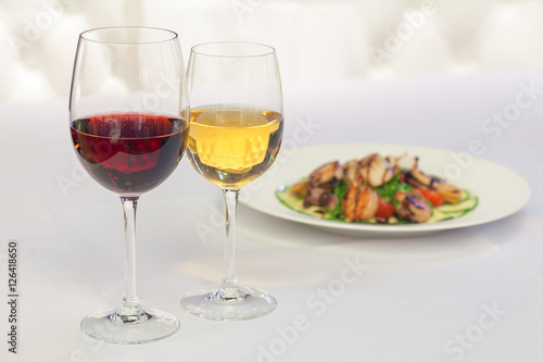 white and red wine in glasses