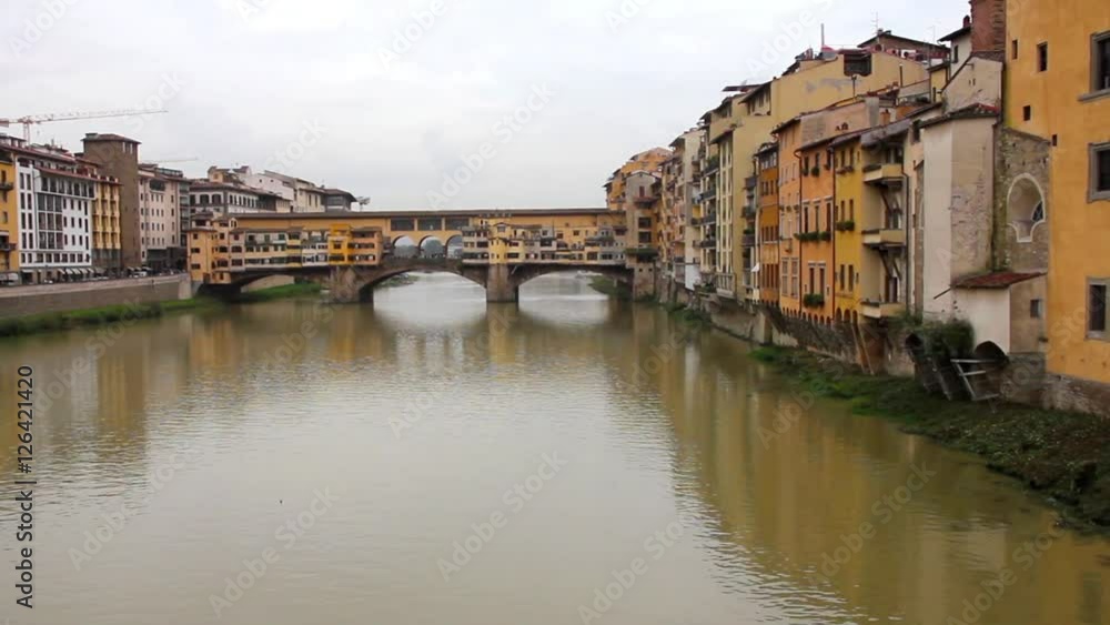 Ponte Vecchio and the Arno river in Florence, Tuscany, Italy Ponte Vecchio and the Arno river in Florence, Tuscany, Italy