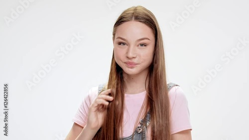 Wallpaper Mural Young beautiful girl smiling over white background. Slow motion. Torontodigital.ca
