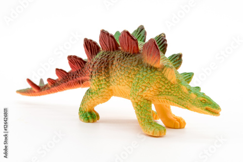 Stegosaurus toy model on white background © Noey smiley