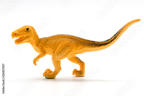 Velociraptor toy model on white background © Noey smiley