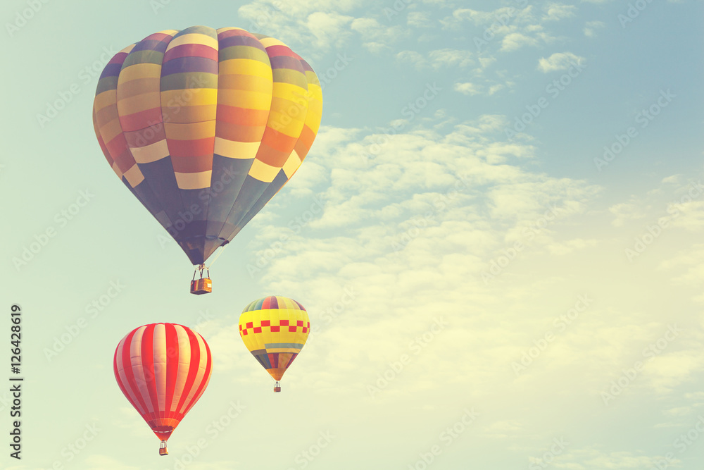 Hot air balloon on sun sky with cloud, vintage and retro instagram filter effect style Hot air balloon on sun sky with cloud, vintage and retro instagram filter effect style