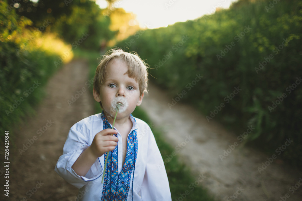 Cute little boy in traditional cloth outside Cute little boy in traditional cloth outside