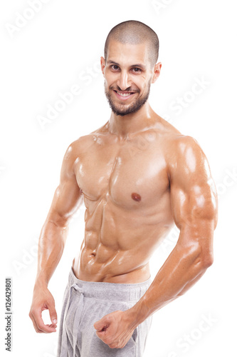 Smiling fit man posing on white background
