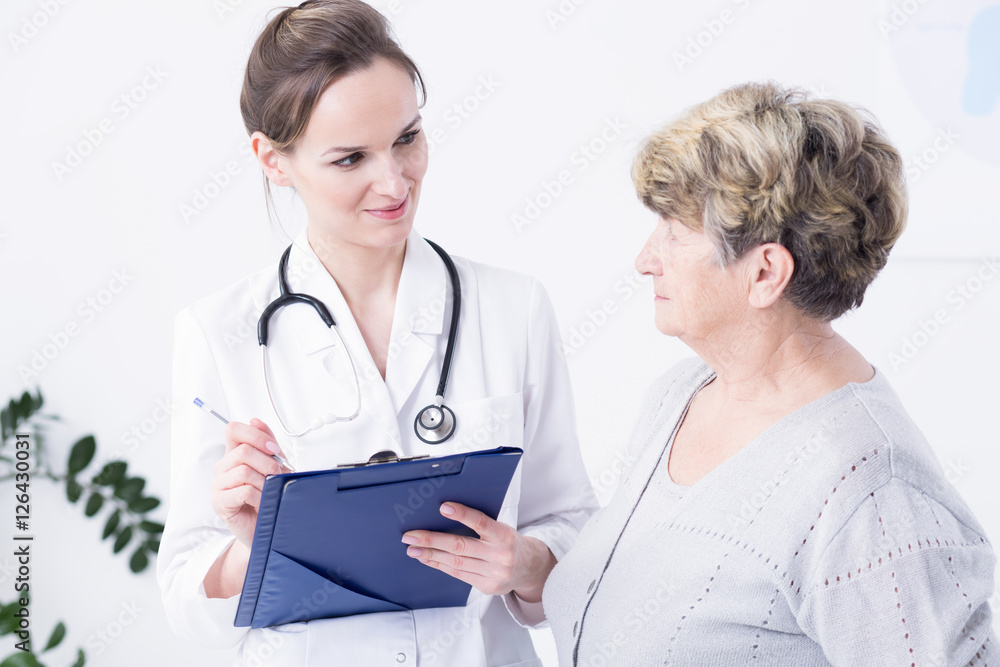 Doctor making the anamnesis with elder woman Doctor making the anamnesis with elder woman