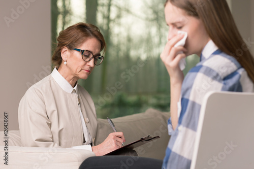 Crying teenager with probation officer