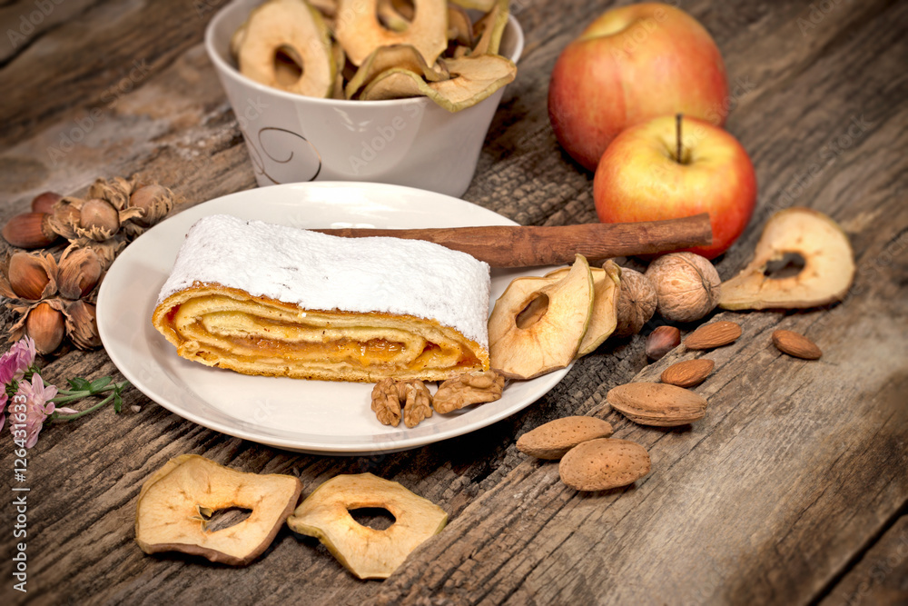 Apple cake - apple pie served on white plate Apple cake - apple pie served on white plate