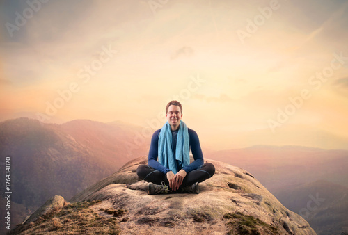 Meditating on top of a rock
