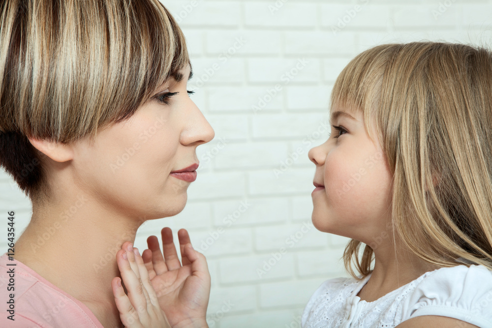 bright picture of hugging mother and daughter