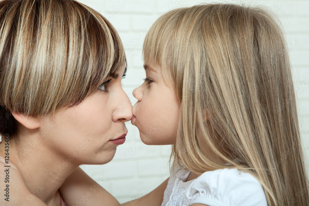 bright picture of hugging mother and daughter