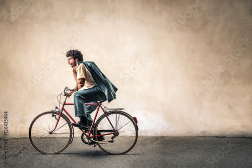 Fototapeta Naklejka Na Ścianę i Meble -  Man riding a bike