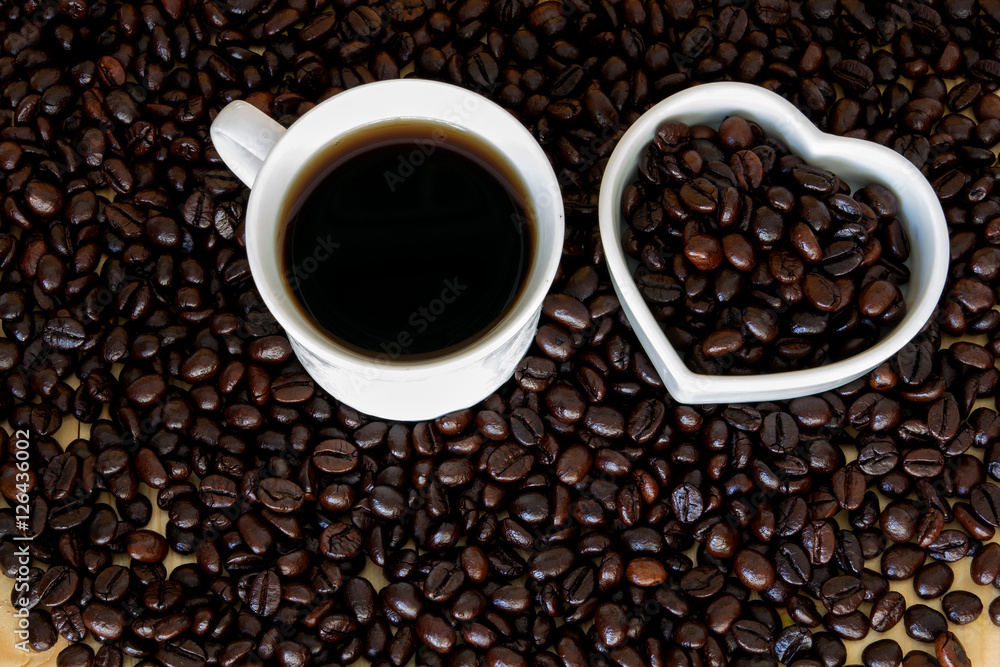cup of coffee with pile of coffee bean , coffee lover concept cup of coffee with pile of coffee bean , coffee lover concept