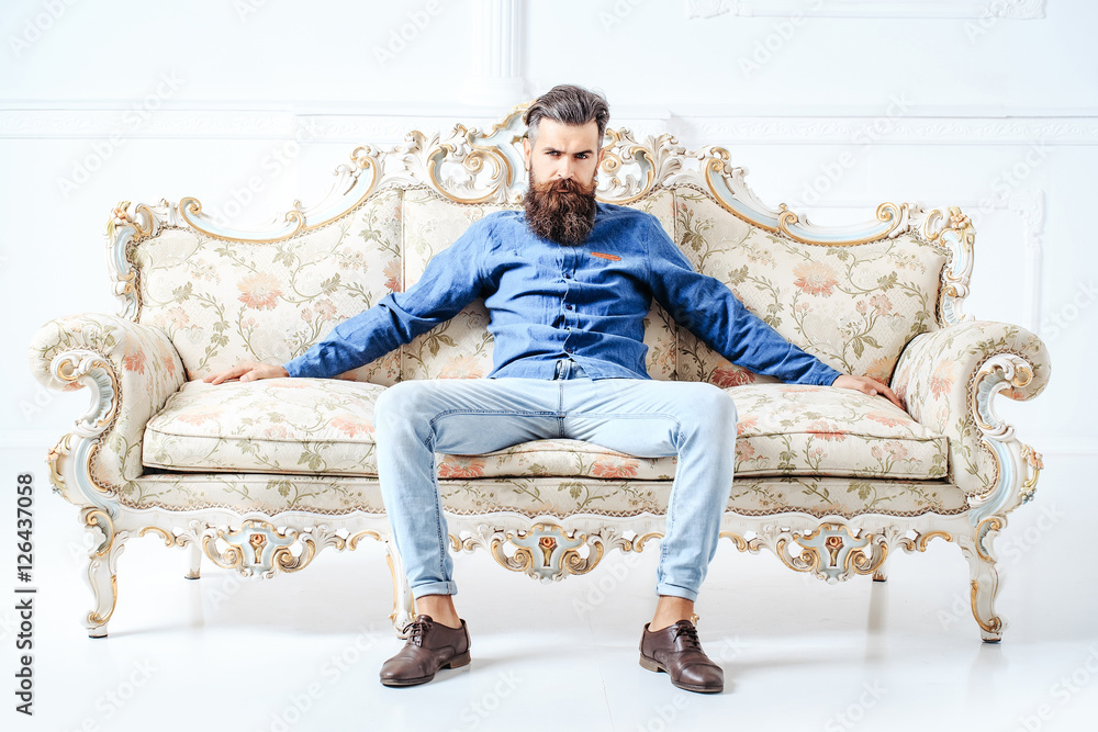 Handsome bearded man on couch Handsome bearded man on couch