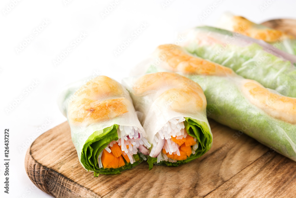 Vietnamese rolls with vegetables, rice noodles and prawns isolated on white background
Vietnamese rolls with vegetables, rice noodles and prawns isolated on white background