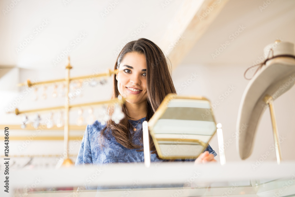 Beautiful woman looking for some earrings Beautiful woman looking for some earrings