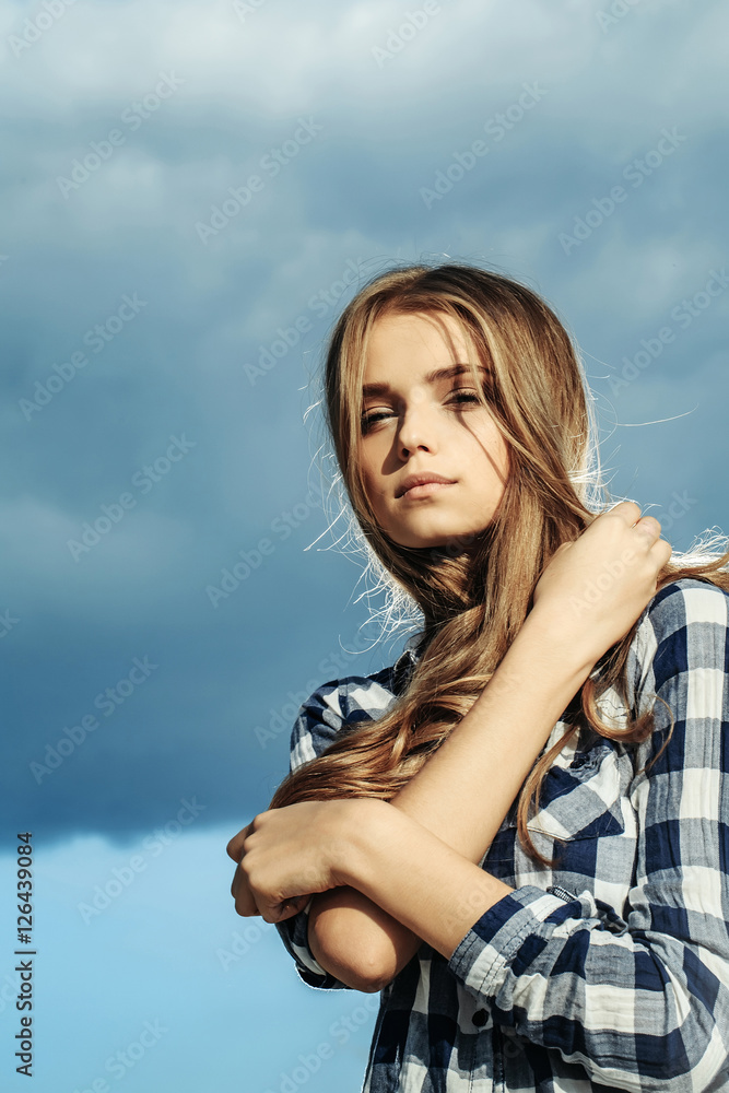 Pretty girl on cloudy sky Pretty girl on cloudy sky