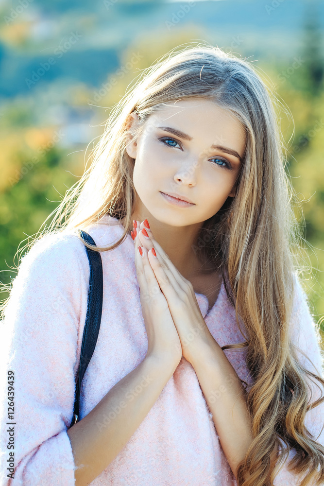 Pretty girl prays outdoors Pretty girl prays outdoors