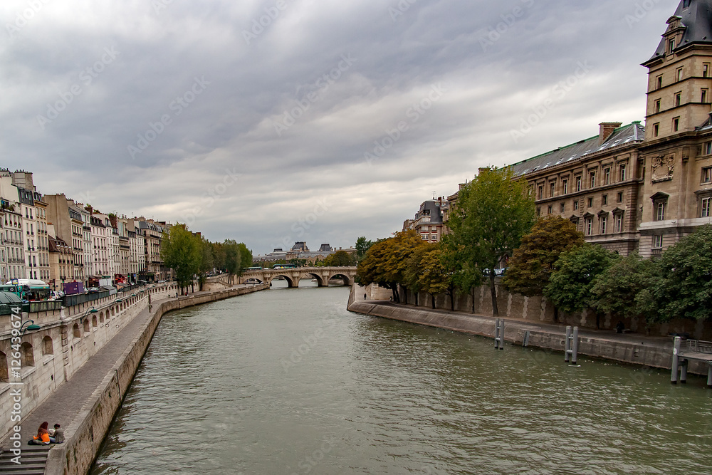 PARIS, FRANCE, circa april 2016. Partial view of the Saint Michel bridge from the quai Saint Michel, on the right the Police Prefecture of Paris