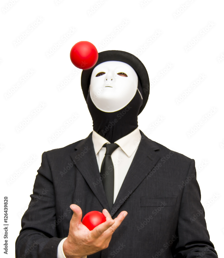 Businessman with a white mask and a hat Juggling with red balls Stock
