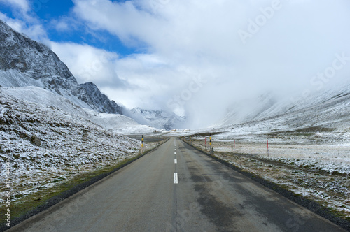 Alpine road on bad weather in Switzerland - Albula Pass photo