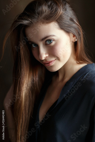 Beautiful female brunette model in shirt