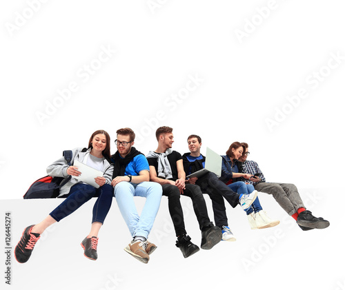 Causal group of people sitting on the floor isolated