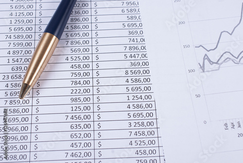 Fotografie Pen lying on the financial statements. Business concept