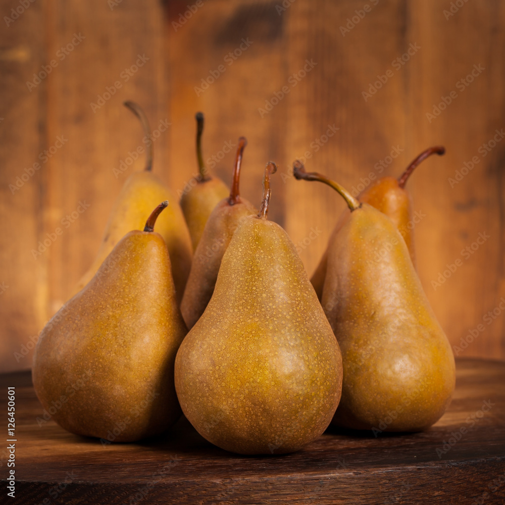 Fresh Ripe Organic Pears on a Wooden Table. Selective focus. Fresh Ripe Organic Pears on a Wooden Table. Selective focus.