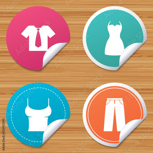 Round stickers or website banners. Clothes icons. T-shirt with business tie and pants signs. Women dress symbol. Circle badges with bended corner. Vector