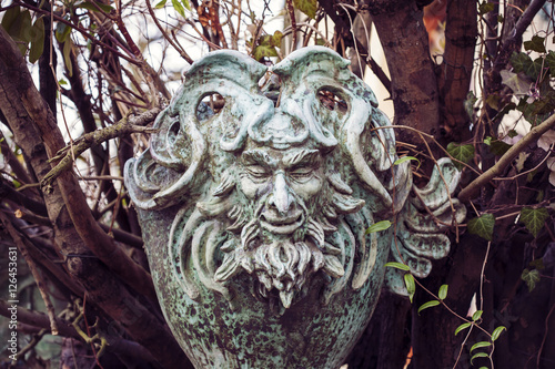 Obraz na plátně Satyr Woodland god face sculpture