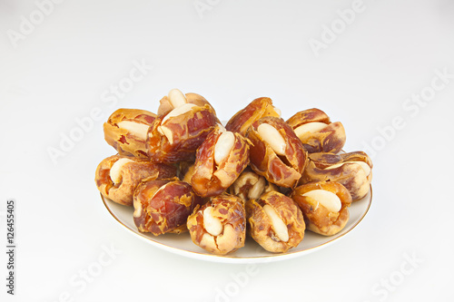 Delicious ripe figs on plate lying on white background