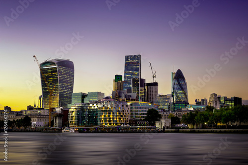 The bank district of central London with famous skyscrapers at sunset with amazing blue sky and reflection  London  United Kingdom