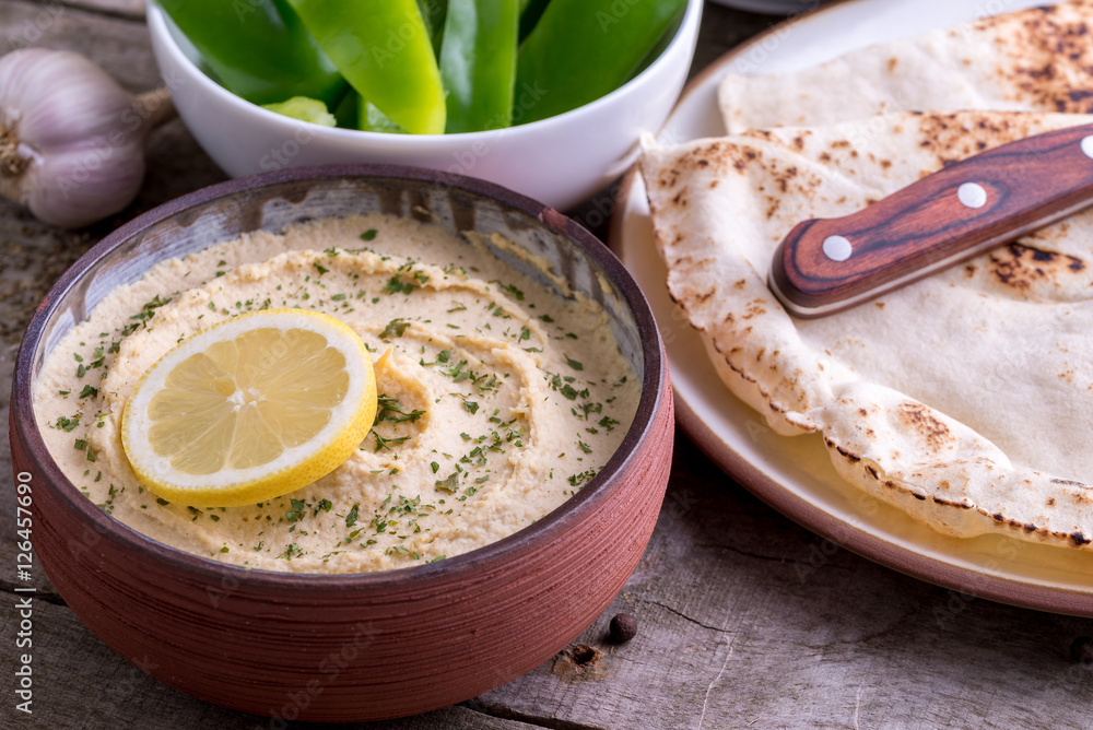 Humus in homemade bowl chapati and vegetable. Humus in homemade bowl chapati and vegetable.