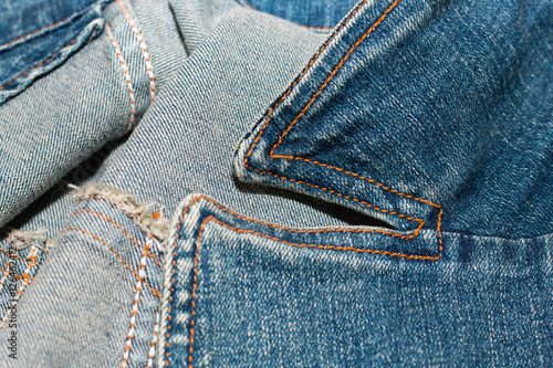 Blue jean or denim on wooden desk,make pattern background,make from cotton