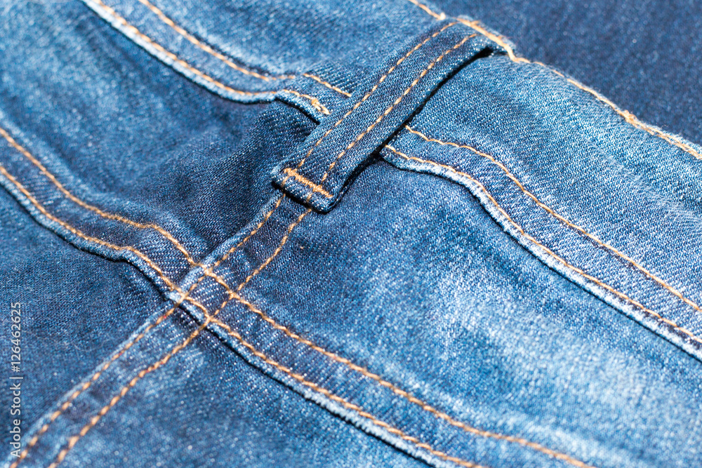 Blue jean or denim on wooden desk,make pattern background,make from cotton,back of jean,bag of jean