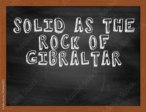 SOLID AS THE ROCK OF GIBRALTAR handwritten text on black chalkbo