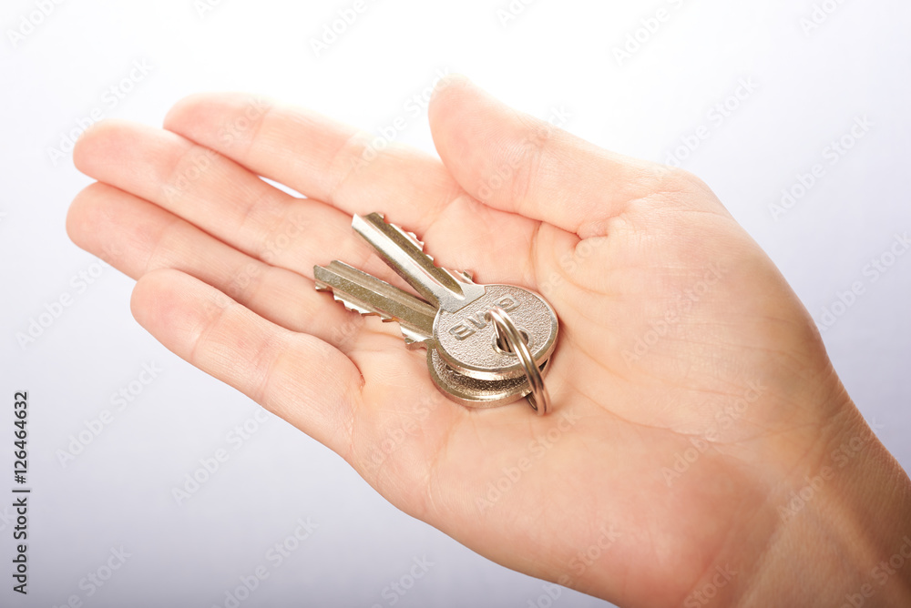 two keys in hand