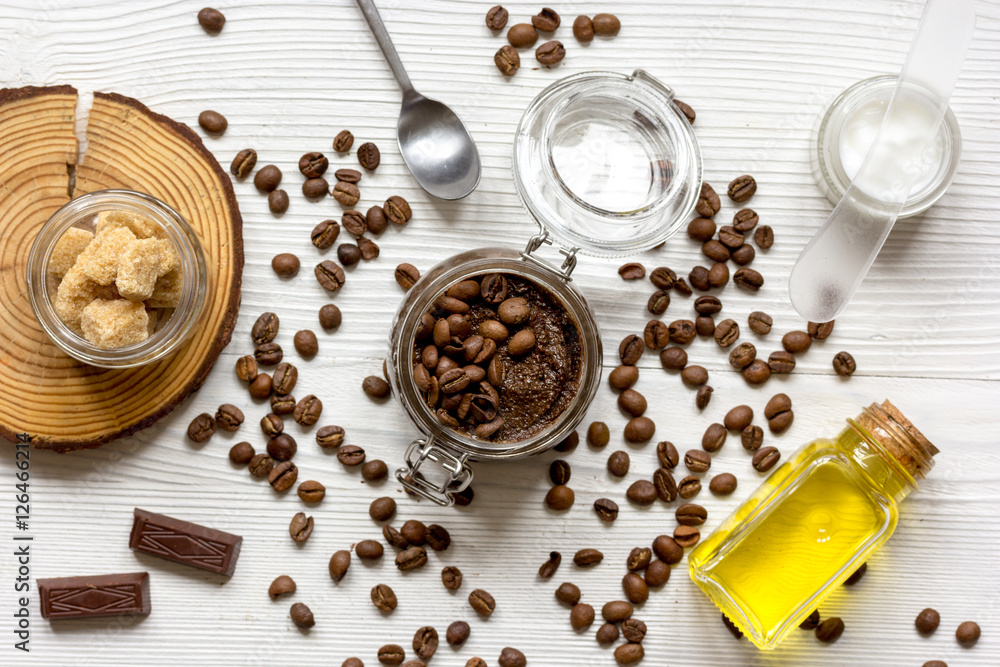 Body scrub of ground coffee top view on wooden table Body scrub of ground coffee top view on wooden table