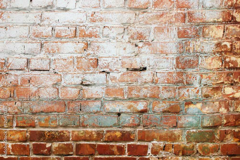 Obraz premium Background of old vintage dirty brick wall with peeling plaster, texture