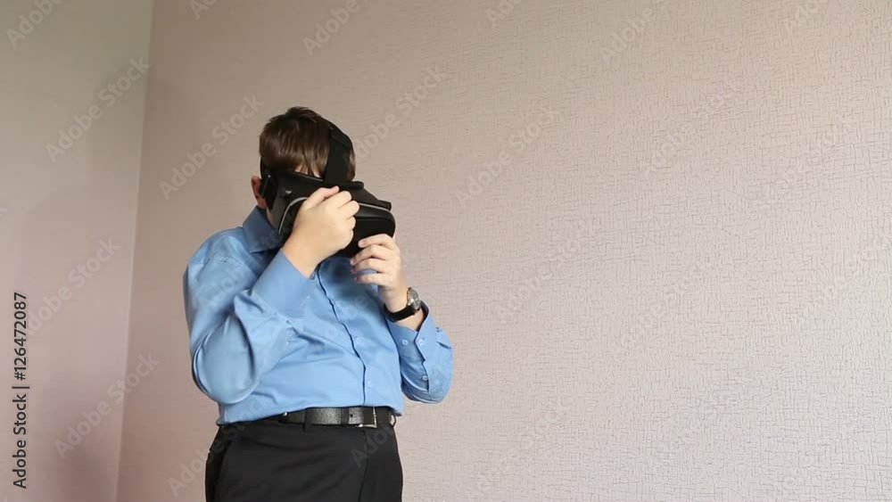 boy playing a virtual reality glasses boy playing a virtual reality glasses
