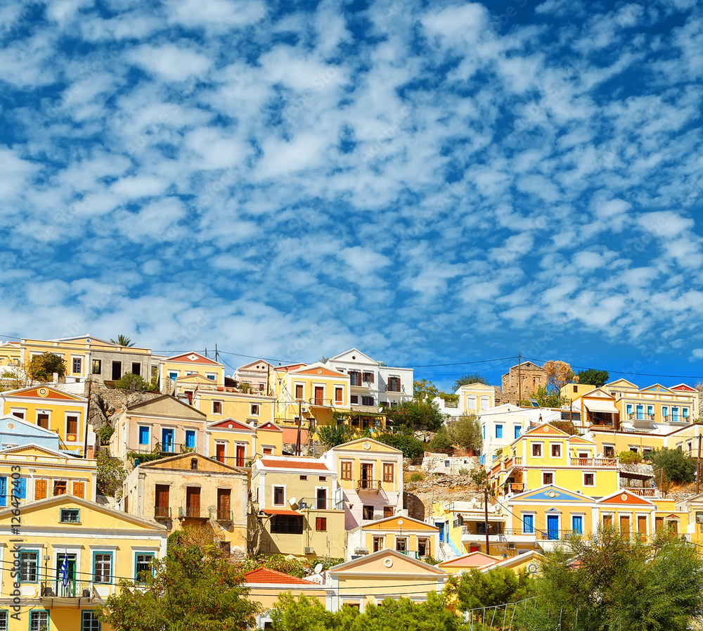 Greece. Dodecanesse. Island Symi Simi . Colorful houses on the rocks