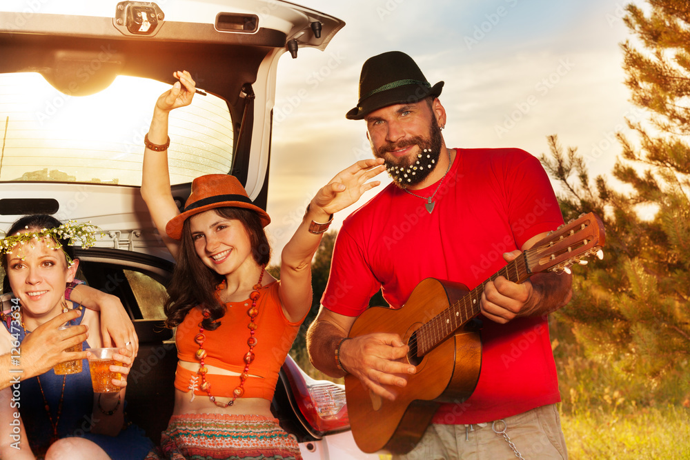 Fototapeta premium Young people having fun during a car trip