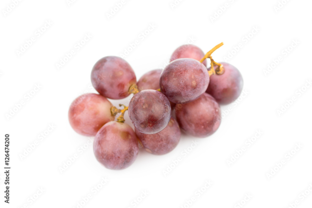 Ripe red grape with leaves isolated on white Ripe red grape with leaves isolated on white