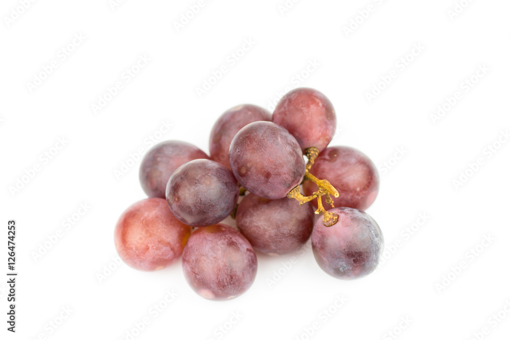 Ripe red grape with leaves isolated on white Ripe red grape with leaves isolated on white