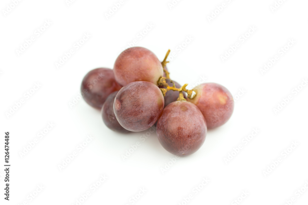 Ripe red grape with leaves isolated on white Ripe red grape with leaves isolated on white