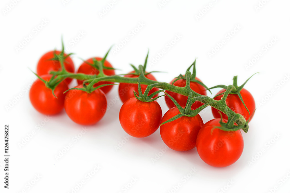 Bunch of fresh red tomatoes isolated on white background