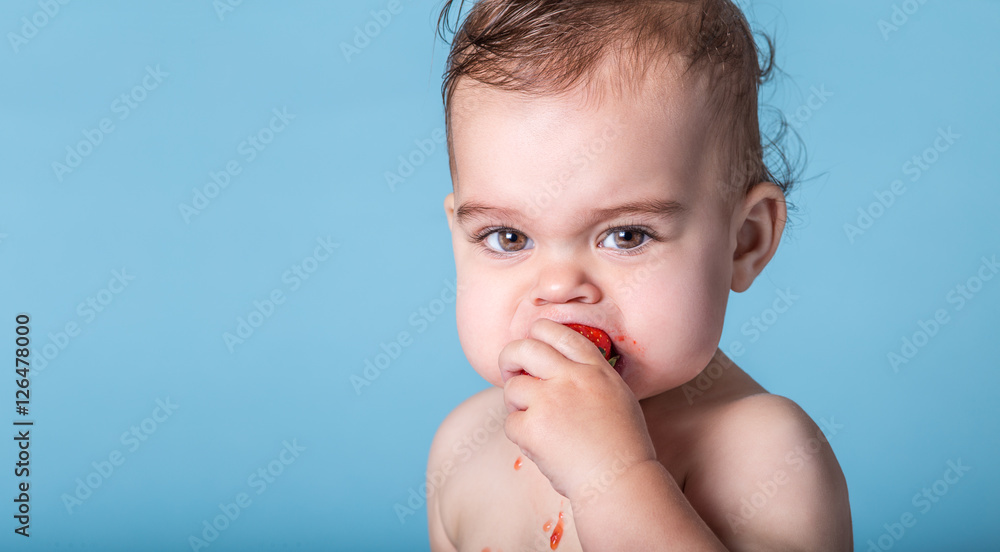 Baby Munching Sour Strawberry and Pulling Squinty Face Baby Munching Sour Strawberry and Pulling Squinty Face