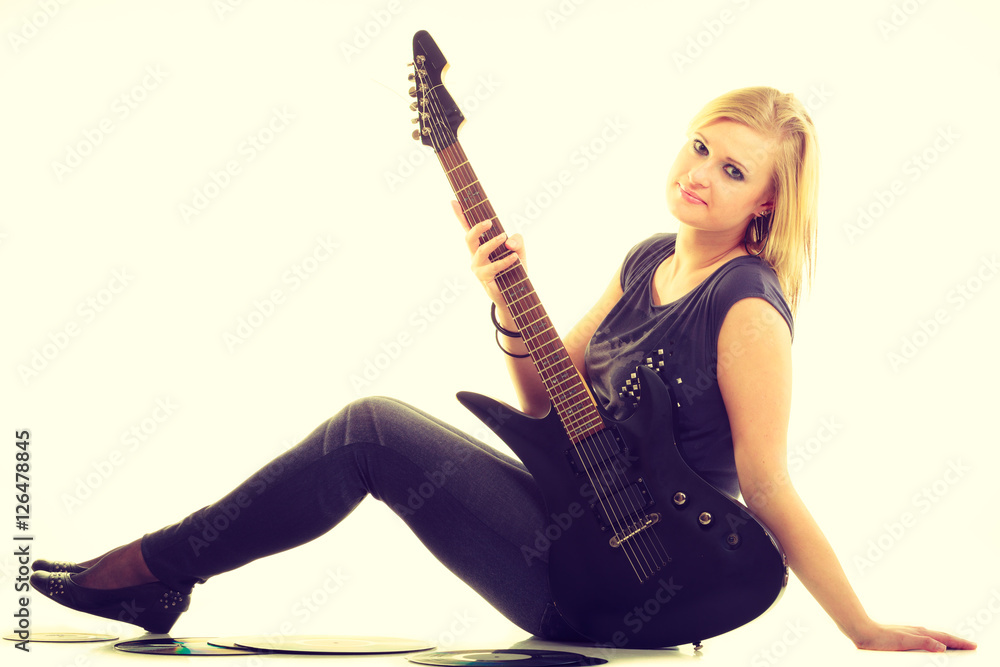 Woman with electrical guitar and vinyl record. Woman with electrical guitar and vinyl record.