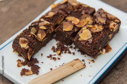 Delicious cake chocolate walnut brownies on wooden desk